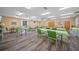 Spacious recreation room features ample seating, tables, and wood-look floors at 2003 Greenbriar Blvd # 1, Clearwater, FL 33763