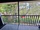Exterior balcony showcasing tree coverage and natural shade at 2131 Ridge S Rd # 76, Largo, FL 33778