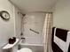 Clean bathroom featuring a toilet, and a shower-tub combo with grab bars at 2131 Ridge S Rd # 76, Largo, FL 33778