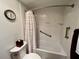 Clean bathroom featuring a toilet, and a shower-tub combo with grab bars at 2131 Ridge S Rd # 76, Largo, FL 33778
