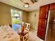 View of the breakfast nook that overlooks the yard, connected to kitchen with stainless steel refrigerator at 2131 Ridge S Rd # 76, Largo, FL 33778