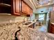 Kitchen sink and countertop area with view of the dining area and stainless steel refrigerator at 2131 Ridge S Rd # 76, Largo, FL 33778