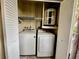 Laundry closet featuring modern appliances and shelving for optimal storage at 2131 Ridge S Rd # 76, Largo, FL 33778