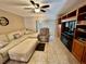 A cozy living room featuring stylish furnishings, a TV and abundant natural light at 2131 Ridge S Rd # 76, Largo, FL 33778