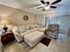 Living room with neutral color palette, plush furniture, and a ceiling fan for added comfort at 2131 Ridge S Rd # 76, Largo, FL 33778