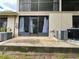 View of the patio, AC unit, screen door, and a small storage closet at 2131 Ridge S Rd # 76, Largo, FL 33778