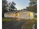 Charming single-story home featuring a two-car garage with updated lighting at 22365 Panorama St, Brooksville, FL 34601