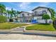 Expansive backyard featuring a pool, outdoor seating area, and a second-story balcony at 234 Palm Sw Is, Clearwater Beach, FL 33767