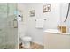 Updated bathroom featuring a glass-enclosed shower, modern vanity, and decorative accents at 234 Palm Sw Is, Clearwater Beach, FL 33767
