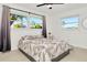 Serene bedroom featuring a neutral color palette and two windows that offer lots of natural light at 234 Palm Sw Is, Clearwater Beach, FL 33767