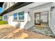 Charming entryway with decorative tile and a welcoming front door, leading into a bright home at 234 Palm Sw Is, Clearwater Beach, FL 33767