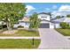 Beautiful two-story home featuring a well-maintained lawn and a spacious two-car garage at 234 Palm Sw Is, Clearwater Beach, FL 33767