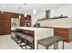 Sleek kitchen with modern appliances, an island with seating, and stylish wooden cabinetry at 234 Palm Sw Is, Clearwater Beach, FL 33767