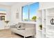 Living room features a sofa, bookshelf, and large window providing natural light and beautiful views at 234 Palm Sw Is, Clearwater Beach, FL 33767