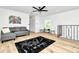 Open concept living room with modern decor, light hardwood floors and an abundance of natural light at 234 Palm Sw Is, Clearwater Beach, FL 33767