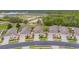 Aerial view of a street with multiple single-Gathering homes in a residential area, each with manicured lawns and landscaping at 241 Royal Palm Way, Spring Hill, FL 34608