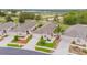 An aerial shot of single-Gathering homes with manicured lawns, landscaping, and a private driveway in a quiet neighborhood at 241 Royal Palm Way, Spring Hill, FL 34608