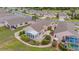 Overhead view featuring the home's layout, gardens, enclosed porch, and neighboring properties at 241 Royal Palm Way, Spring Hill, FL 34608
