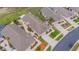 An aerial view capturing single-Gathering homes, screened patios, and landscaped yards within a vibrant neighborhood at 241 Royal Palm Way, Spring Hill, FL 34608