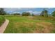Scenic backyard with a brick path and ample green space at 241 Royal Palm Way, Spring Hill, FL 34608