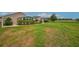 Expansive backyard view showing lawn and enclosed porch at 241 Royal Palm Way, Spring Hill, FL 34608