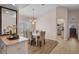 Dining room features a chandelier, a mirror, and lots of natural light at 241 Royal Palm Way, Spring Hill, FL 34608
