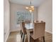 Dining room features a chandelier and lots of natural light at 241 Royal Palm Way, Spring Hill, FL 34608