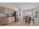 Bright kitchen with stainless steel appliances, table, and lots of counter space at 241 Royal Palm Way, Spring Hill, FL 34608