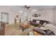 Spacious living room with hardwood flooring, ceiling fan, and lots of natural light at 241 Royal Palm Way, Spring Hill, FL 34608