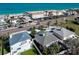 Aerial view of residences on a sunny day, with beach, palm trees, and street views at 2801 Gulf Blvd, Belleair Beach, FL 33786