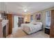 Spacious bedroom featuring carpet flooring, a ceiling fan and neutral colors in a well lit space at 2801 Gulf Blvd, Belleair Beach, FL 33786