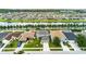 Aerial view of neighborhood featuring well-maintained homes, manicured lawns, and a canal at 30317 Rattana Ct, Wesley Chapel, FL 33545