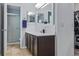 Bathroom with vanity, tiled floor, and shower with glass door at 30317 Rattana Ct, Wesley Chapel, FL 33545