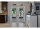 Bright kitchen with double doors leading to a patio, plus a coffee bar for added convenience at 30317 Rattana Ct, Wesley Chapel, FL 33545