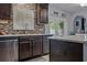 Kitchen featuring stainless appliances, backsplash, granite countertops and a convenient center island at 30317 Rattana Ct, Wesley Chapel, FL 33545