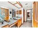 Bathroom featuring granite countertops, wooden cabinets, and a large mirror with vanity lighting at 3133 Harvest Moon Dr, Palm Harbor, FL 34683