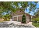 Spacious home featuring an attached two-car garage and manicured landscaping, offering a blend of comfort and style at 3133 Harvest Moon Dr, Palm Harbor, FL 34683