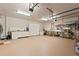Clean and spacious garage with ample storage, featuring built-in cabinets and shelving for organization at 3133 Harvest Moon Dr, Palm Harbor, FL 34683