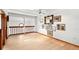 Open hallway with railing overlooking lower level; features wood floors and artwork at 3133 Harvest Moon Dr, Palm Harbor, FL 34683