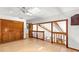 Spacious hallway with wood floors, closet and railing overlooking the floor below at 3133 Harvest Moon Dr, Palm Harbor, FL 34683