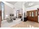 Bright living room features high ceilings, a fireplace, and large windows, creating a welcoming atmosphere at 3133 Harvest Moon Dr, Palm Harbor, FL 34683