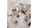 Bird's eye view of cozy living room with fireplace, comfortable seating, and floor to ceiling windows at 3133 Harvest Moon Dr, Palm Harbor, FL 34683