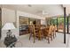 Inviting screened patio with ample seating, perfect for dining and entertaining at 3133 Harvest Moon Dr, Palm Harbor, FL 34683