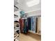 Organized walk-in closet with ample shelving and hanging space for clothing and accessories at 3133 Harvest Moon Dr, Palm Harbor, FL 34683