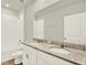 Bathroom features double sink vanity, granite countertops, bathtub and tile flooring at 3146 Forrest Plum Ct, Zephyrhills, FL 33540