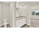 Bathroom featuring a double sink vanity with granite countertop and tile flooring at 3146 Forrest Plum Ct, Zephyrhills, FL 33540