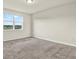 Bright, carpeted bedroom with a large window offering plenty of natural light and views at 3146 Forrest Plum Ct, Zephyrhills, FL 33540
