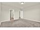 Carpeted bedroom with neutral walls and access to the ensuite bathroom and walk-in closet at 3146 Forrest Plum Ct, Zephyrhills, FL 33540