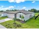 Well maintained single Gathering home with manicured front yard and a two-car garage at 3146 Forrest Plum Ct, Zephyrhills, FL 33540