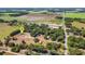 An aerial view showcasing the property's location, landscaping and surrounding greenery at 3147 Sydney Dover Rd, Dover, FL 33527